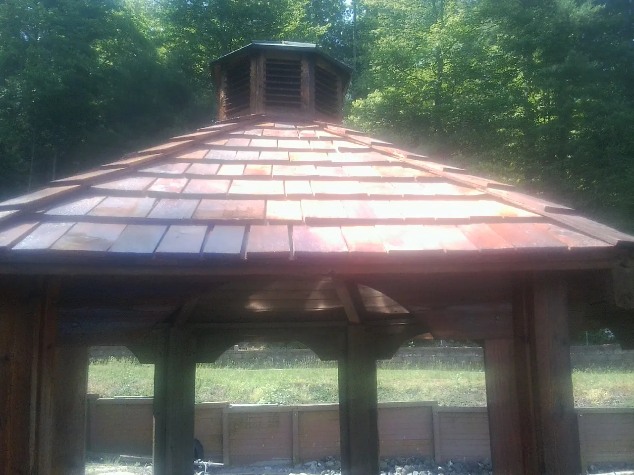 New cedar shake roof and cupola on a lakeside gazebo in Pendleton